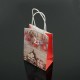 12 petits sacs kraft de Noël décor Père Noël et chaussons 12x17x7cm - 7543