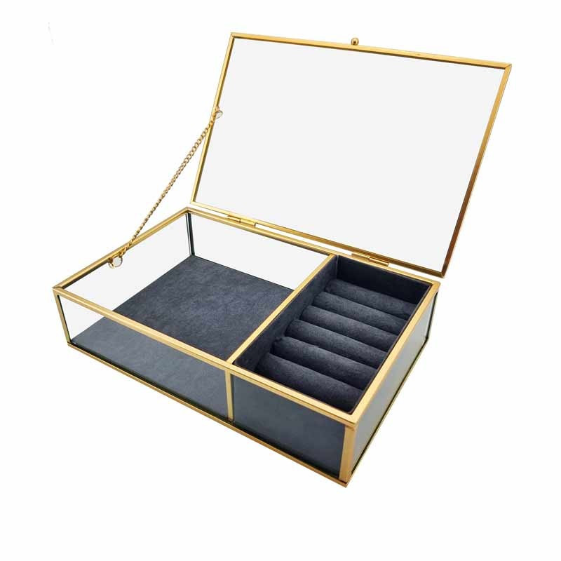 Caja para joyas de metal dorado y vidrio con fondo de ante gris antracita