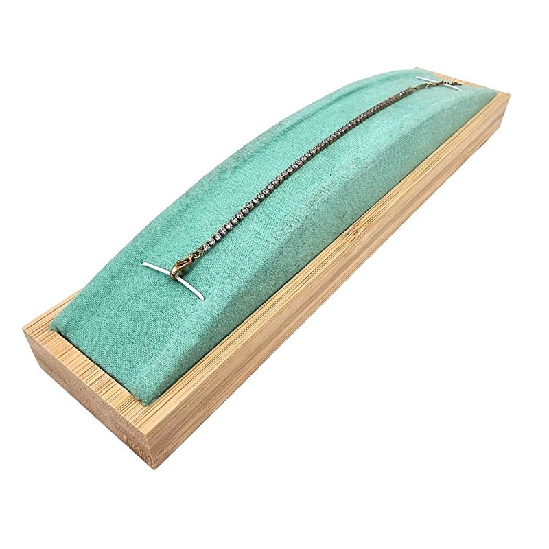 Support à bracelet bombé en bois de bambou et en suédine vert lagon