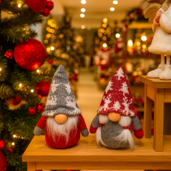 Pareja de pequeños duendes de navidad rojos y gris