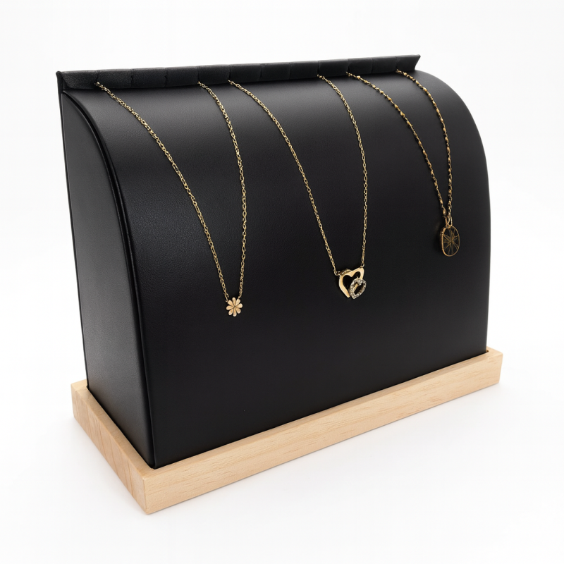 Soporte para collares voluminoso de madera y de símil piel negra