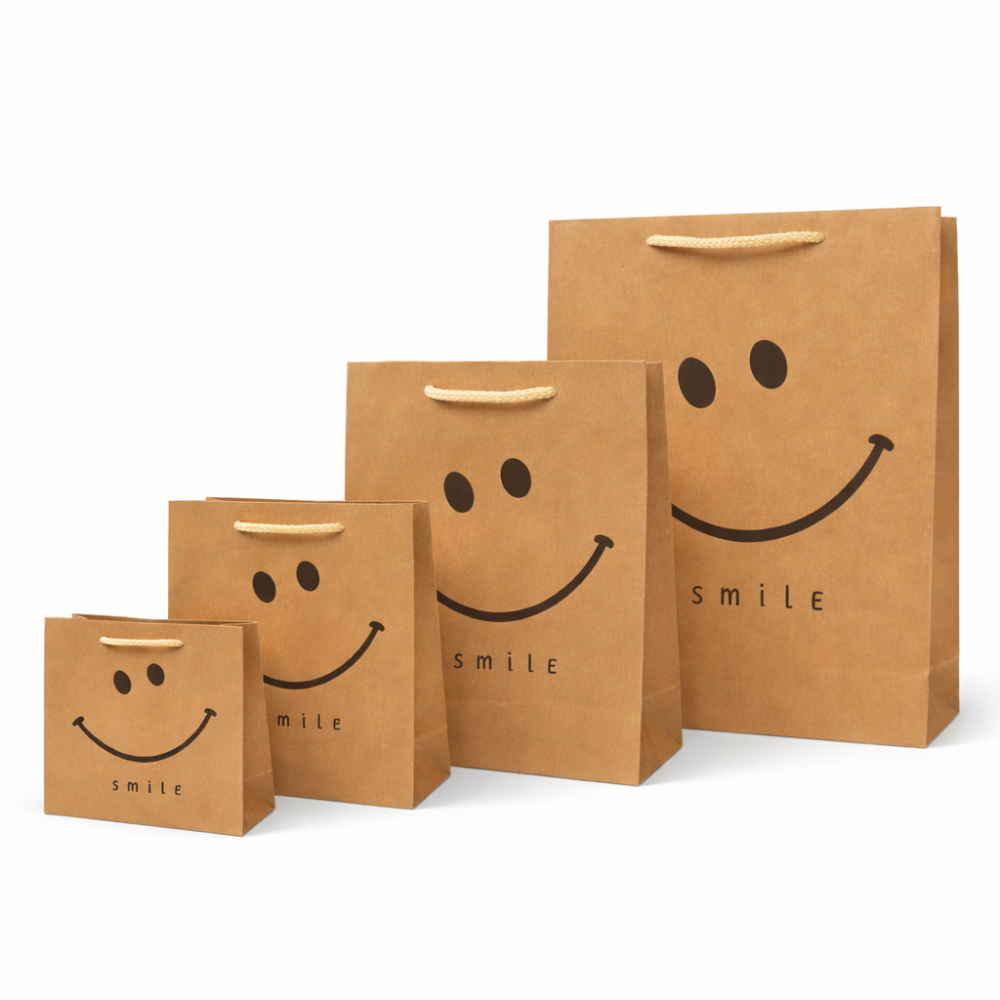 Pack completo de bolsas de papel kraft con smiley «Classic Smile» - ¡Formato XL gratis!