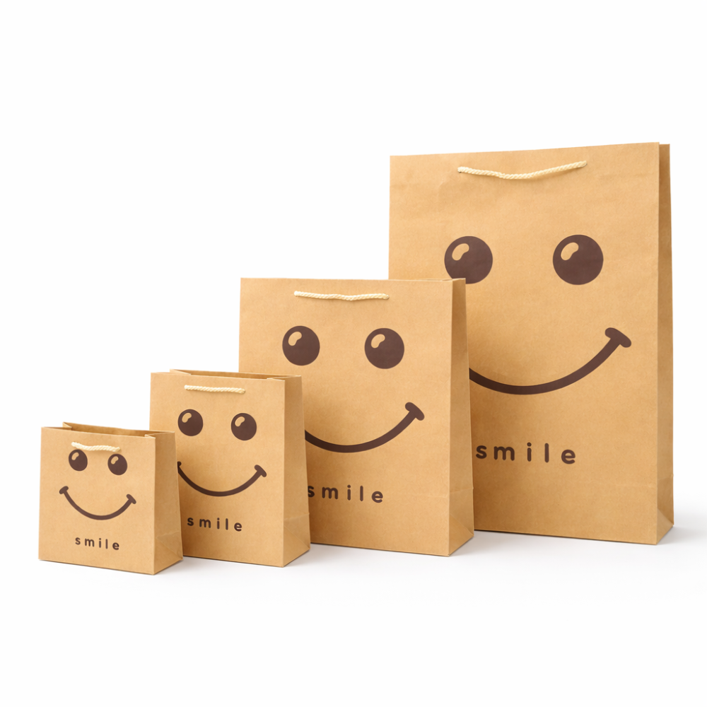 Pack completo de bolsas de papel kraft Smiley «Happy Face» - Formato XL de regalo