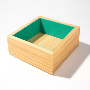 Petit casier pour coussin de montre en bois et en suédine vert lagon
